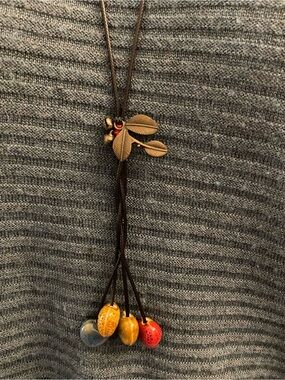 Unique necklace with 4 ceramic differently patterned hearts.